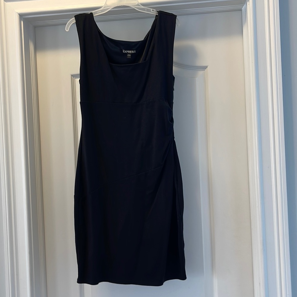 Black mini dress with side zip and side rousching detail.